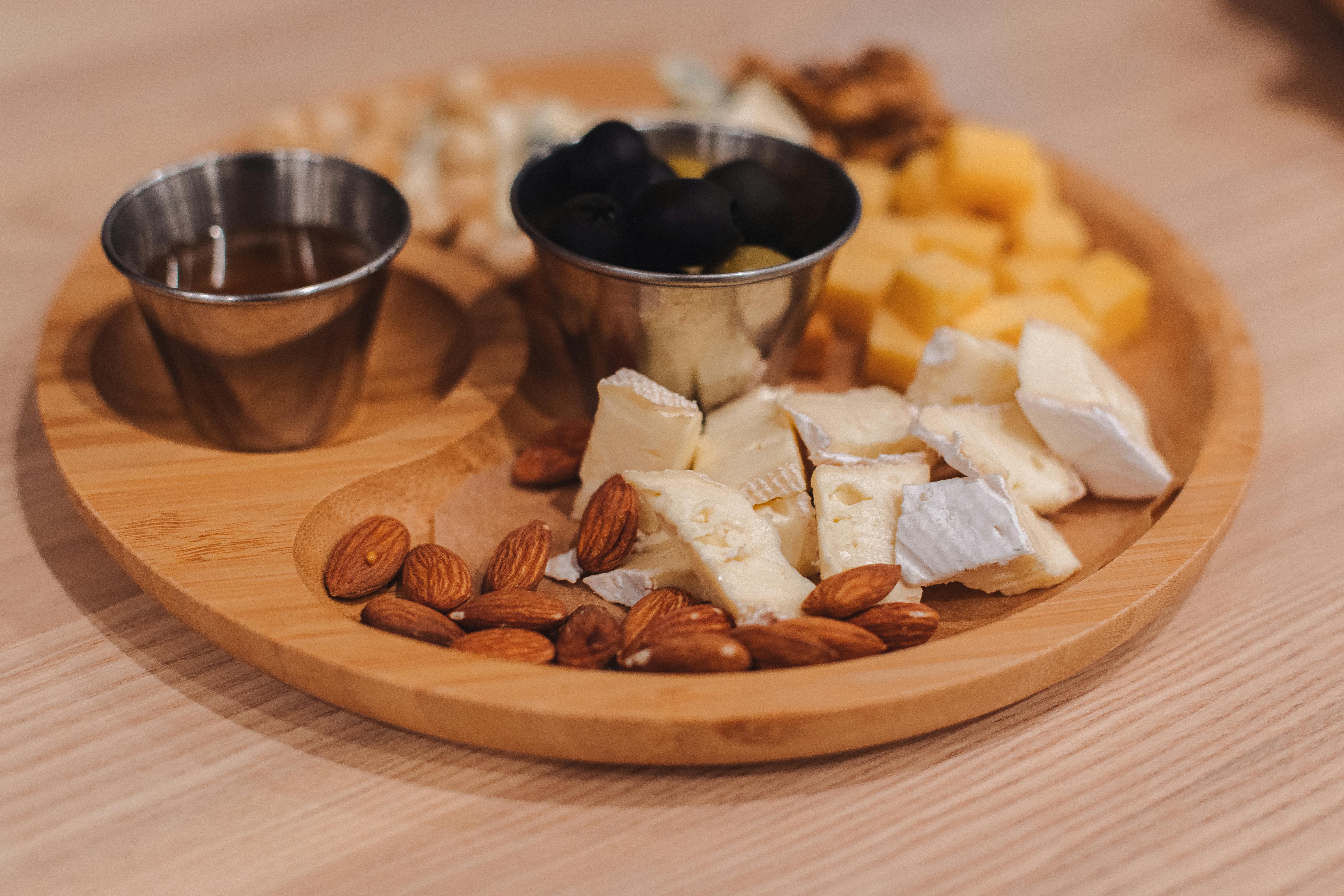 Prepared cheese tray with cheese and almonds